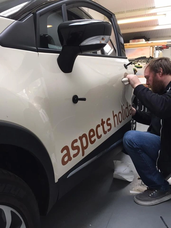 Vehicle graphic fitting