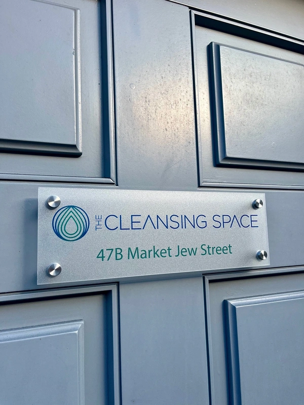 Acrylic door sign with stand off locators